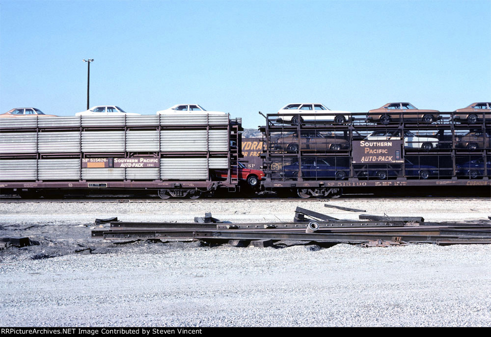 Southern Pacific tri-levels with auto poking out. Note sure of car make.